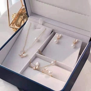 Exquisite butterfly jewelry set with necklace and earrings displayed in a luxury box