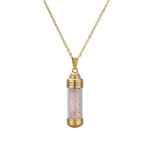 Golden perfume bottle pendant necklace with pink crystal stones in a glass vial