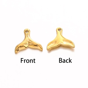 Detailed front and back view of gold whale tail charms for DIY jewelry making