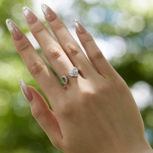 Macro shot of S925 sterling silver heart and D-letter ring with inlaid zircon stones