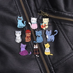Set of 10 colorful cartoon cat metal brooches pinned on a black leather jacket