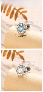Detail view of 0.8cm hexagonal zircon earrings with light blue and clear stones
