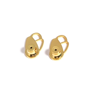Macro shot of gold-plated earring lifters showing the polished metal finish and unique disk shape