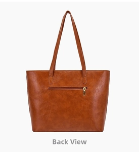 Back view of textured brown faux leather tote bag with functional zipper pocket