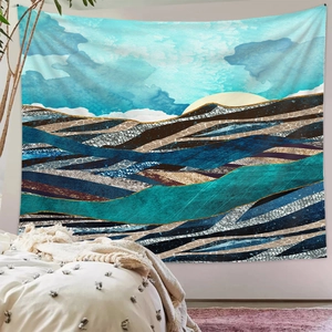 Detail of abstract blue and gold mountain tapestry hanging in a modern bedroom setting