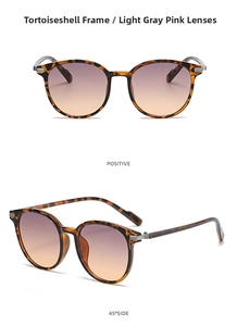 Detail view of tortoise frame sunglasses with gradient grey and pink lenses and silver hinge