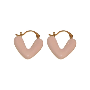 Minimalist pink enamel V-shaped heart earrings in gold plating on white background