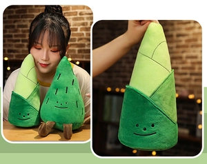 Detailed view of bamboo shoot plush toy with cute embroidered face and soft texture