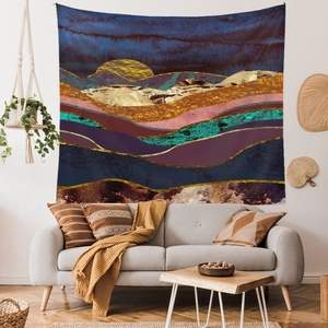 Detailed close-up of an abstract mountain landscape tapestry in a modern living room
