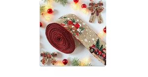 Close-up of burlap Christmas ribbon roll with red bell and vintage truck patterns