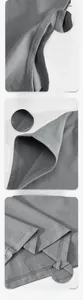 Detailed close-up of grey quick-dry vest stitching on cuffs and hem for athletic wear