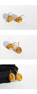Detailed views of gold earrings featuring oval faceted yellow gemstones on white background