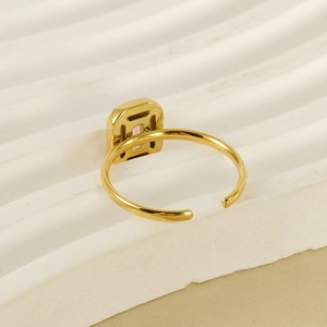 Macro shot of 18K gold plated adjustable ring featuring a pink rectangular zircon stone