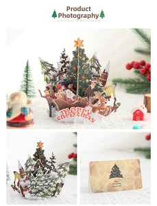 Detailed view of 3D Christmas card showing laser-cut Santa sleigh and festive pop-up layers