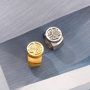 Detailed view of gold and silver Hamsa rings with sparkling rhinestone accents