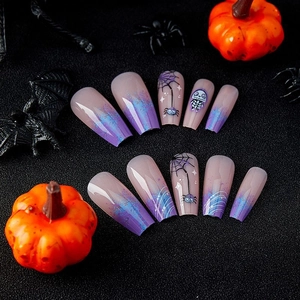Blue and purple Halloween coffin press-on nails featuring spider web and skull designs