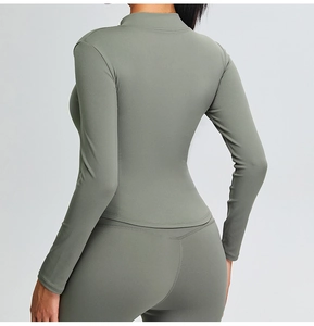 Rear view of slim fit yoga top with stand collar and matching high-waist leggings