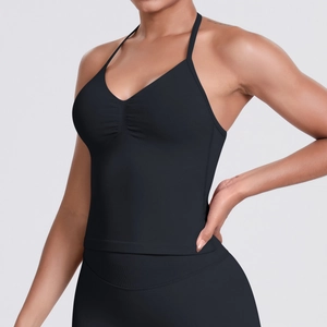 Detail of black seamless halter yoga top with ruched V-neckline and moisture-wicking fabric