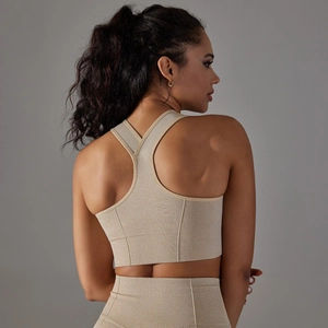 Close-up of racerback seamless knitted sports bra in light khaki with breathable texture