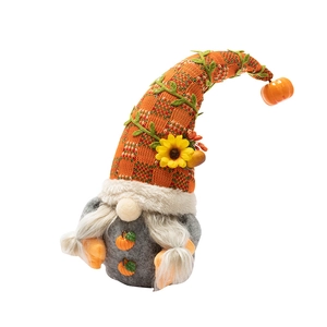 Fall harvest gnome plush with sunflower and pumpkin details on white background