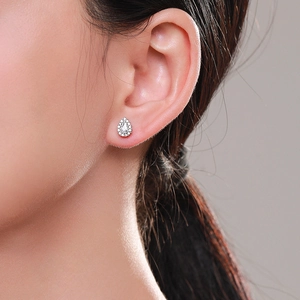 Elegant S925 sterling silver teardrop stud earrings with pavé crystals on model