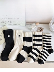 Detail of five-pair set of cotton crew socks with stars and stripes in monochrome