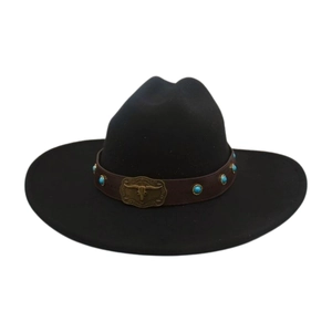 Detail of western cowboy hat featuring leather band with bull head buckle and turquoise studs