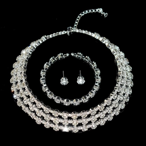 Macro shot of luxury silver plated necklace and earrings set with sparkling crystals