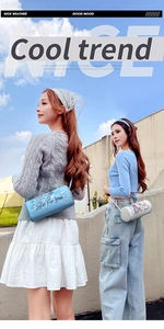 Blue and white cylindrical crossbody bags with cartoon graphics and Lucky For You text