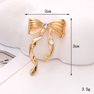 Golden bowknot zinc alloy accessory with white rhinestones for DIY crafts, 2x3cm size