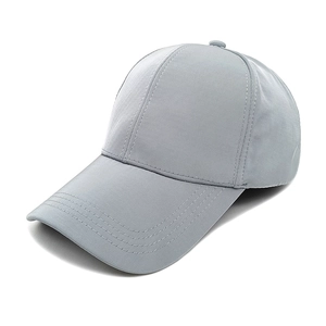 Detail view of light grey quick-dry baseball cap with reinforced seams and vent holes