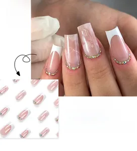 French style press-on nails with marble texture and colorful rhinestones at the base