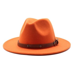 Detail of orange fedora wool hat with brown leather belt and metal rivet buckle