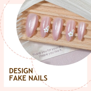 Pink cat eye press-on nails with 3D white floral accents and French tips style