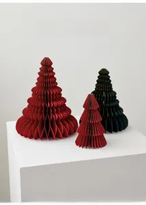 Three-piece paper honeycomb Christmas tree decorations with gold trim on white podiums