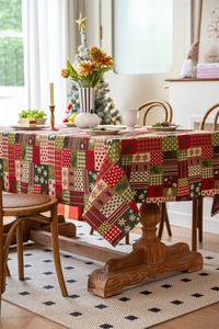 Detail of Christmas tablecloth showing reindeer and snowflake patterns on cotton linen