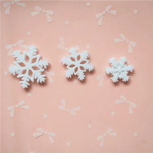 White snowflake resin charms in three sizes with glitter for DIY crafts and accessories