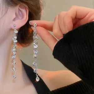 Elegant long tassel earrings with silver round cubic zirconia stones for women
