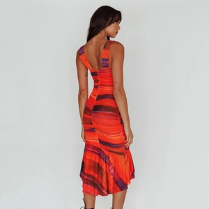 Detail of cross back straps and orange tie-dye pattern on slim fit backless dress