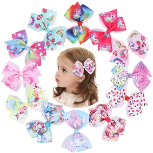 Collection of colorful 4-inch bow hair clips with unicorn, rainbow and heart prints