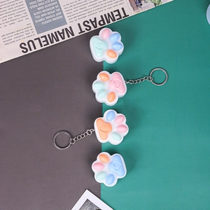 Cat paw fidget toy keychains in various colors with silicone material and metal rings