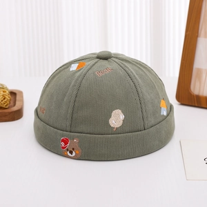 Detail of army green ribbed docker hat with cute bear embroidery and Bear text