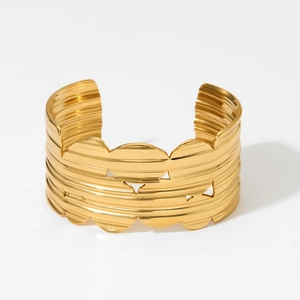 Minimalist wide gold wavy textured open cuff bracelet with elegant hollow details