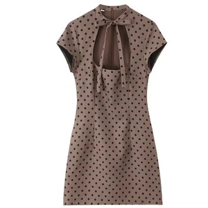 Polka dot short dress with high neck, cutout bow detail and cap sleeves in brown and black