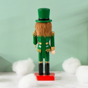 Back view of a green 25cm wooden nutcracker with shamrock details and a red square base