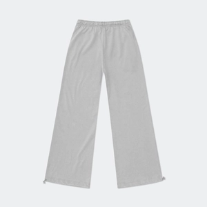 Detail of adjustable drawstring cuffs and elastic waistband on wide-leg grey joggers