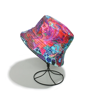 Detail of colorful graffiti print bucket hat with vibrant street art patterns on display