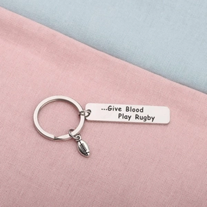 Stainless steel rugby keychain with oval ball pendant and engraved Give Blood Play Rugby charm