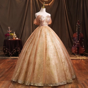 Elegant champagne off-shoulder ball gown with shimmering beadwork and tulle skirt
