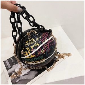 Detail of basketball shaped handbag with colorful graffiti prints and acrylic chain